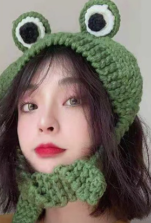 Frog headband with eyes and ties worn on a model