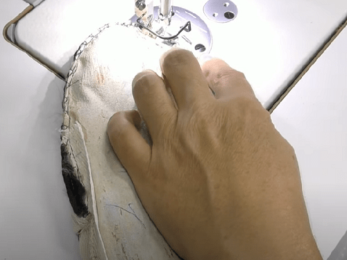 Sewing fur mittens on a sewing machine