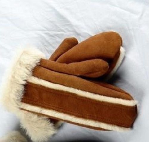 Hand-sewn fur mittens with a decorative seam