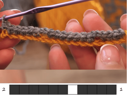 Row 2 of lazy jacquard crochet with a chain-stitch gap