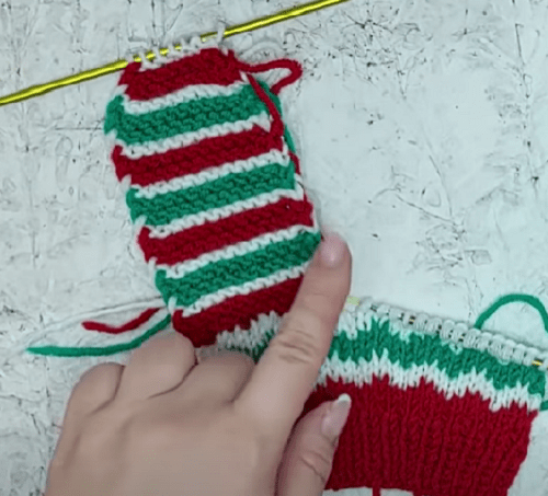 Decreases on the striped front section of the Christmas slipper