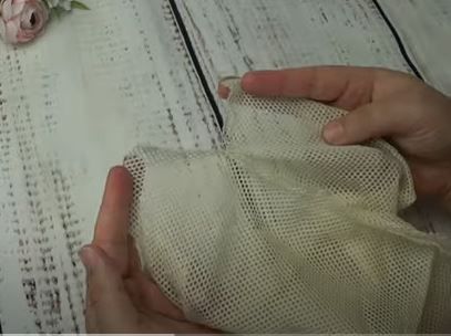 Folding the mesh edge for the drawstring casing
