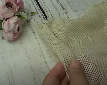 Folded mesh bag piece before sewing the side seams