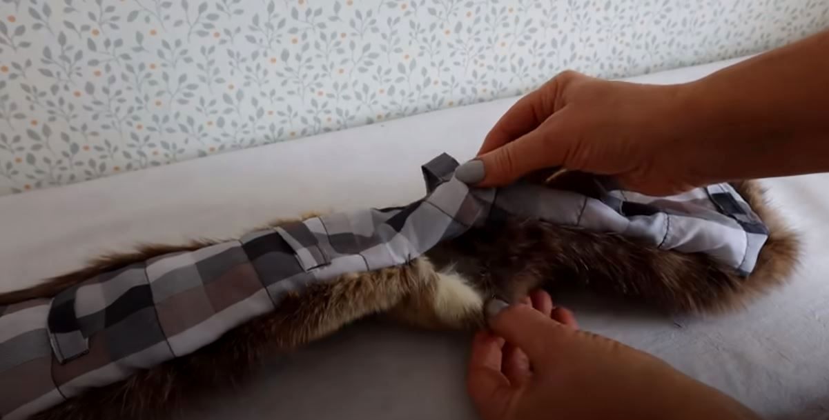 Hand-joining the fur piece with the collar lining