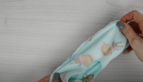 Children’s fleece slipper sock held in hands