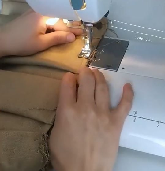 Sewing the short sides of the pleated panel into a ring
