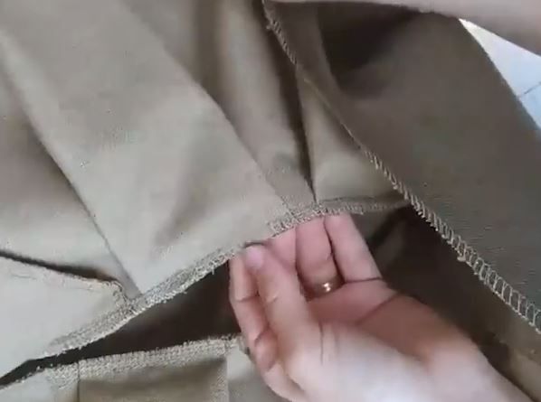 Turning the finished seam allowance toward the yoke