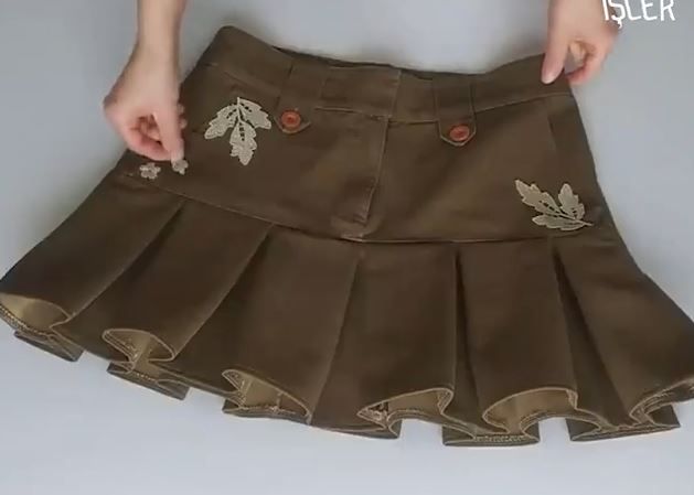 Finished skirt from old trousers decorated with heat-transfer appliqués