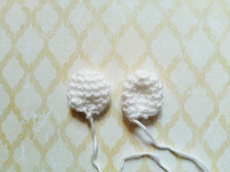 Two crocheted ear pieces for the mouse