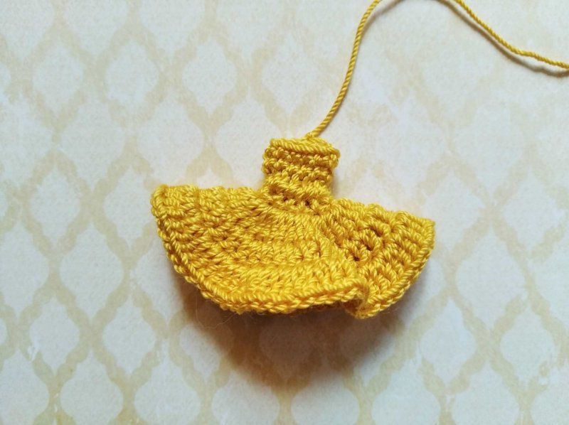 Crocheted yellow dress for the mouse brooch