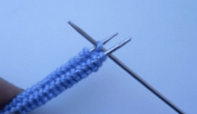Moving stitches to a third needle