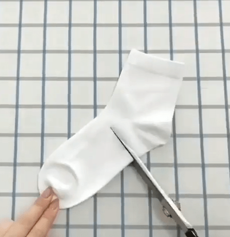 Cutting a white sock below the heel