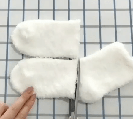 Two white sock sections after a crosswise cut