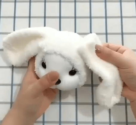 Long ear pieces being placed against the bunny's head