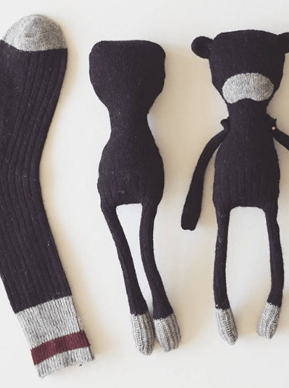 Black sock and cut-out soft-toy pieces