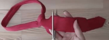 Removing the long tail and label from a tie