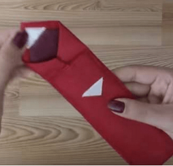 Velcro strips sewn to base and flap of the tie pouch