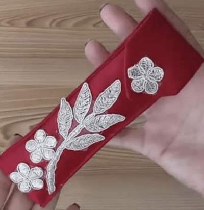 Finished stylish pouch made from a necktie