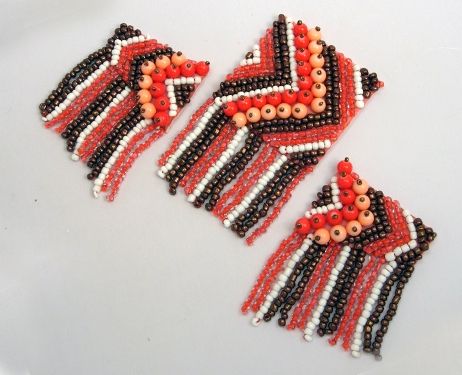 Three finished swimsuit embellishments with seed beads and fringe