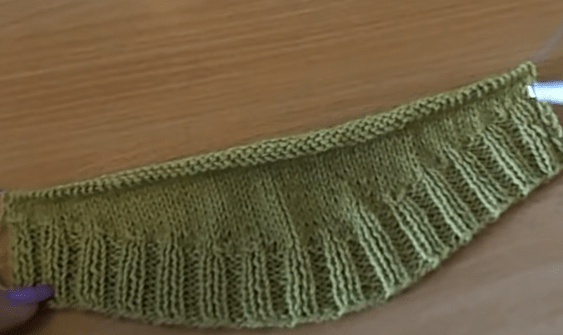 Fabric on the needle with a smoothly rounded lower edge after the short rows