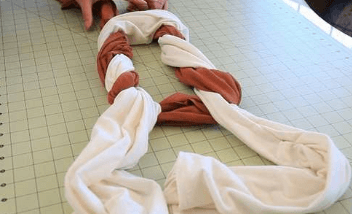 Partially woven T‑shirt scarf with loose ends