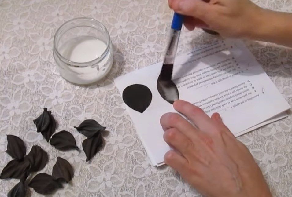 Applying glue stiffener to leather petals