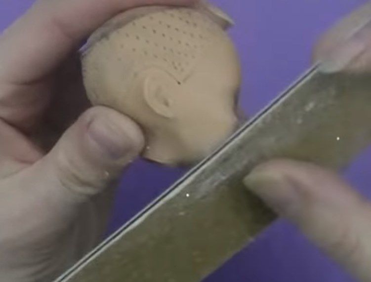 Коррекция профиля лица куклы пилкой