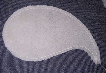 Light-colored backing piece for reverse appliqué