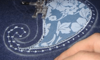 Decorative stitching along the curl of the appliqué
