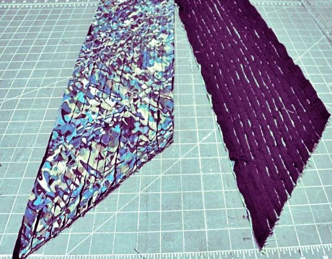 Cut upper fabric layers on a scarf blank