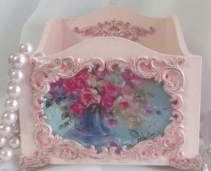 Wooden rococo-style box with pink decor and a floral image