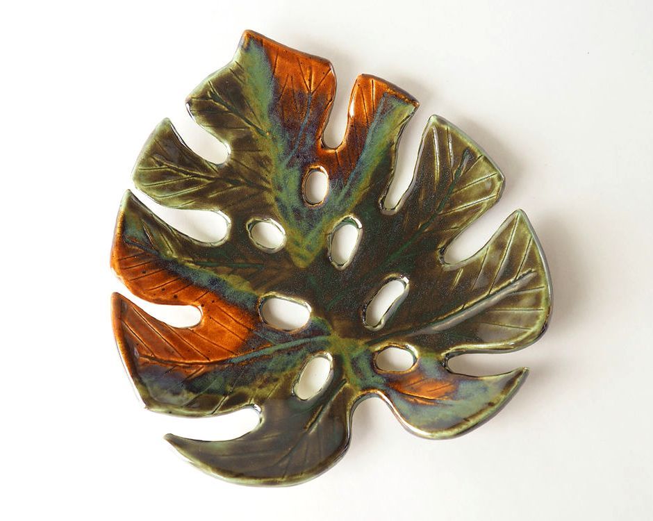 Painted clay monstera soap dish with green and brown spots