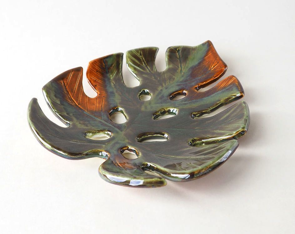 Finished soap dish shaped like a painted clay monstera leaf