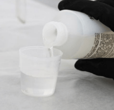 Adding the second resin component to the cup