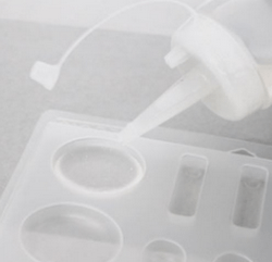 Pouring resin into a silicone mold
