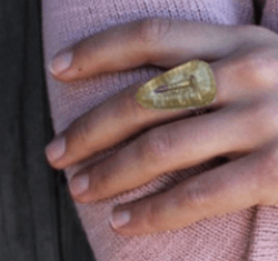 Yellow resin ring on a hand