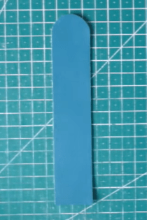 Cut blue closure piece for the notebook