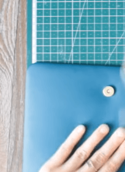 Snap fastener installed on a blue notebook cover
