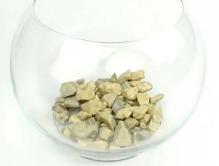 Layer of stones at the bottom of a glass vase