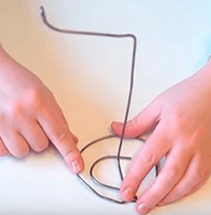 Curved wire base for a floating cup