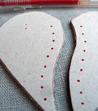 Punched holes in the leather heart pieces