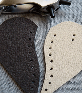 Leather heart laced with brown cord