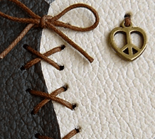 Decorative lacing and a hanging loop on a leather heart