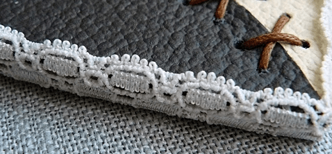 Lace trim along the edge of the leather heart