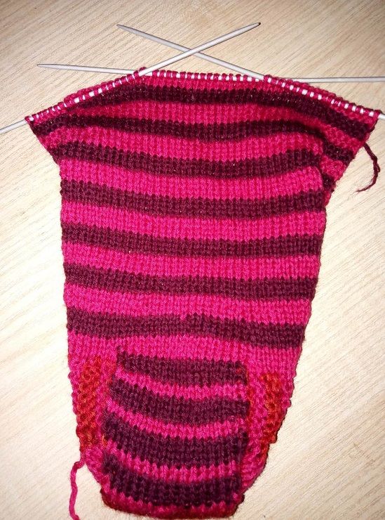 Knitted slipper sock before the heel is bound off