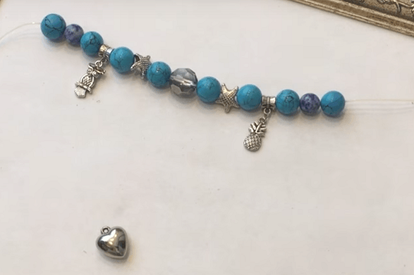 Beads and charms on wire for a bracelet