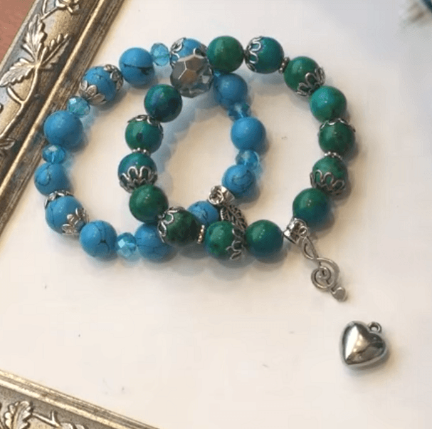 Two bracelets made with blue and green beads