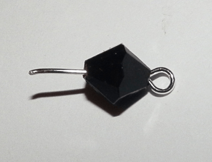 Black faceted bead on a pin with a loop