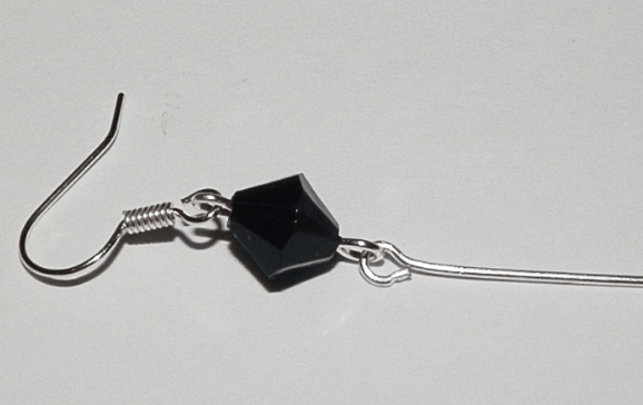 Pendant on a pin attached to the ear wire