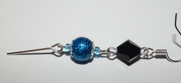 Earring with beads on connecting pins